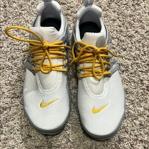 Nike Women’s White and Gold Sneakers